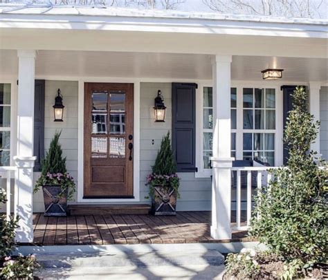 grey siding navy shutters.